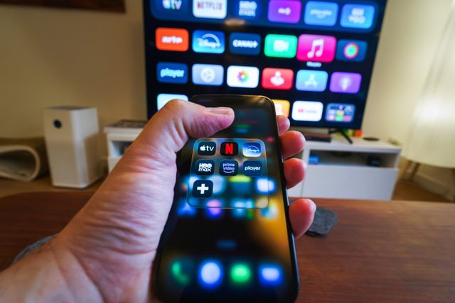 Jakub Zerdzicki: hand holding smartphone with streaming apps (https://www.pexels.com/photo/hand-holding-smartphone-with-streaming-apps-35490407/) Hand holding smartphone with streaming apps